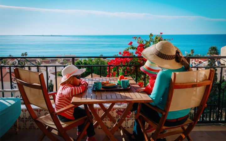 Family having lunch by the sea, Costa Brava